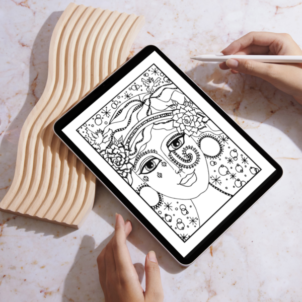 woman with Apple pencil coloring on an iPad